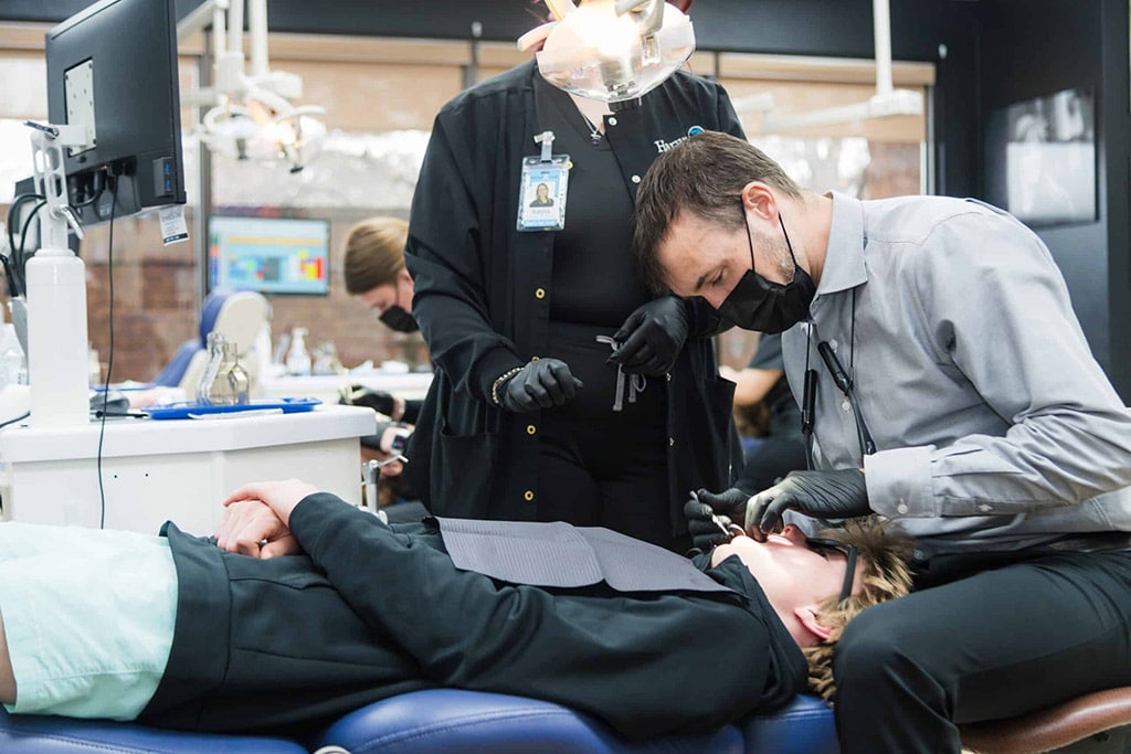 Dr. Cook cleaning teeth