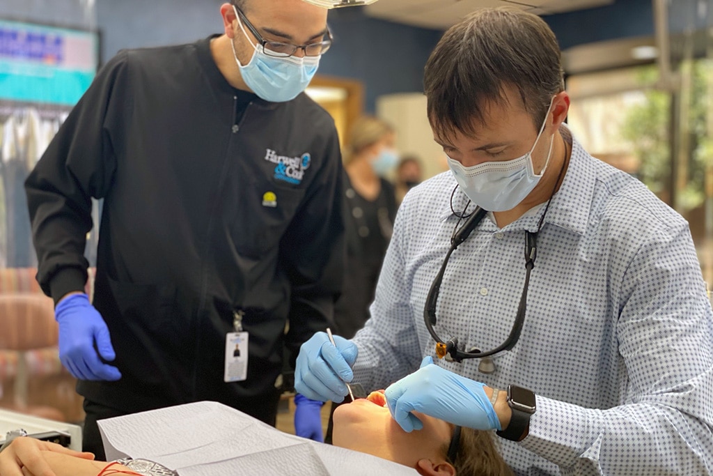 An orthodontist working on a patient | Harwell & Cook Orthodontics