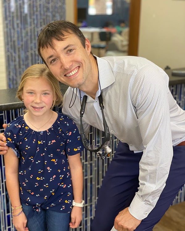 Dr. Cook and a young girl | Harwell & Cook Orthodontics