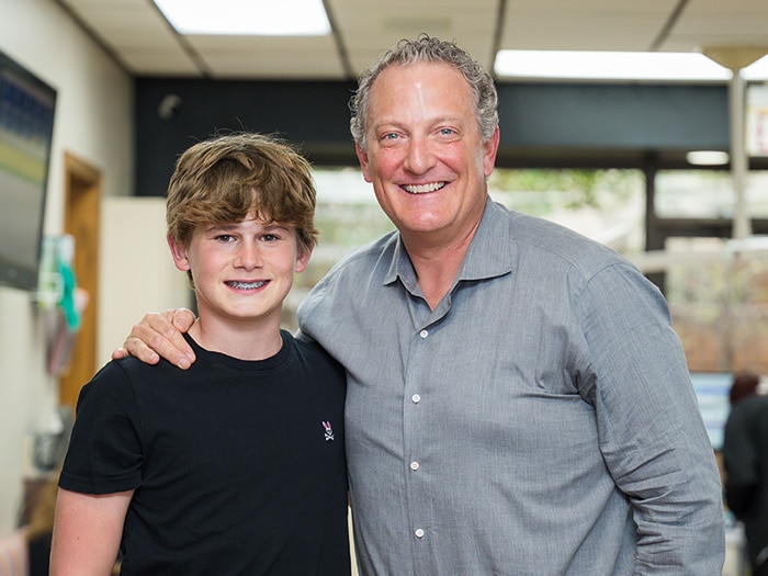 Dr. Anthony and a young boy smiling. | Harwell & Cook Orthodontics