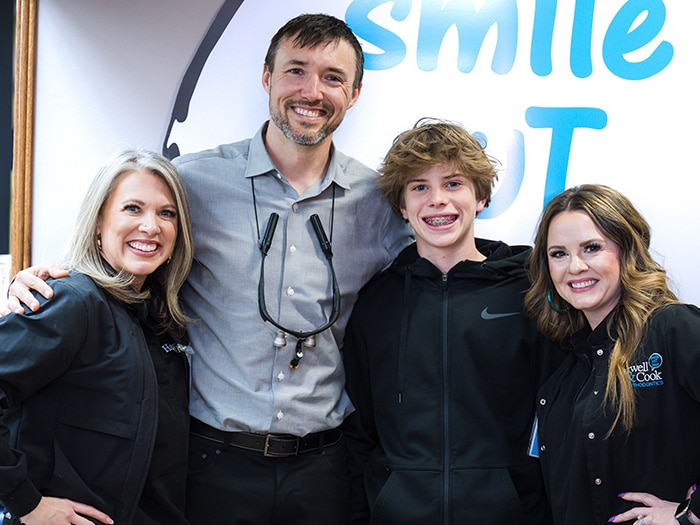 A group photo with Dr. Cook and patients. | Harwell & Cook Orthodontics