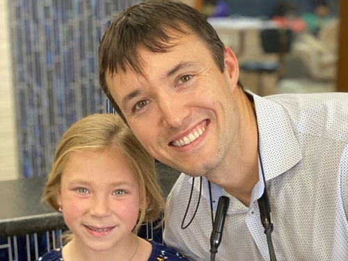 Dr. Cook and a young girl smiling. | Harwell & Cook Orthodontics