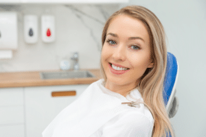 Smiling woman sitting in a dental chair during an appointment